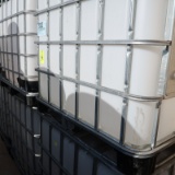 large plastic containers in steel cages