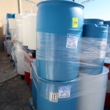 pallets of plastic & steel barrels