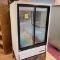 True 2-glass-door checkstand refrigerator, on crates
