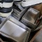crate of stainless pans, sheet pans, TP holders, etc