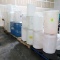 pallets of plastic barrels