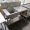 stainless table w/ backsplash & single compartment sink