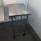 stainless table w/ wire shelves, on casters