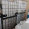 plastic containers in steel cages- IBC totes