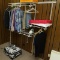 contents of room: closet hardware w/ clothes, desk, suitcase, HP Deskjet, etc