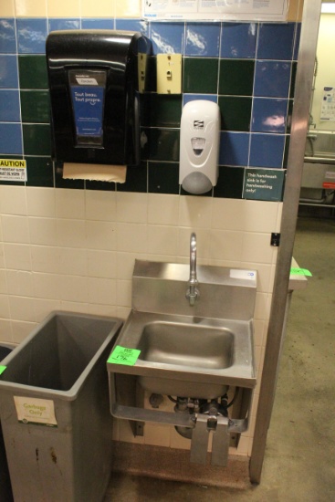 Stainless sink with paper towel and soap dispenser