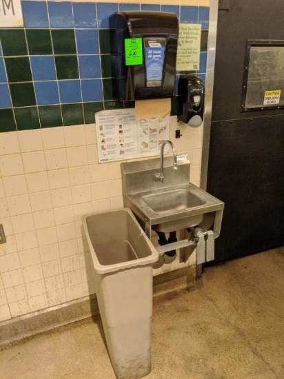 Stainless sink with paper towel and soap dispenser