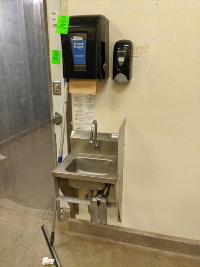 Stainless sink with paper towel and soap dispenser