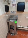 Stainless sink with paper towel and soap dispenser