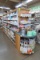 wooden shelving island, mirrored w/ glass shelves one side