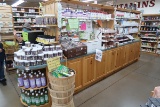 wooden shelving island, mirrored w/ glass shelves one side