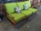 Wood bench with cushion and throw pillows
