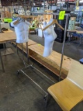 Clothing rack with hangers and mannequins