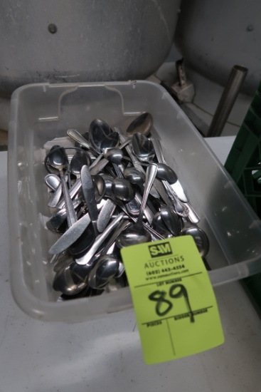 plastic tub of spoons