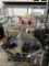 wire shelving unit & shopping cart full of sign holders & marketing paraphernalia