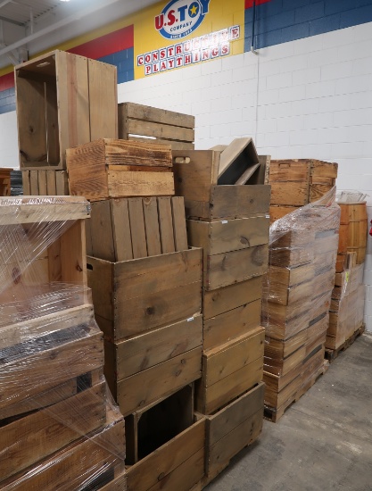 pallets of wooden crates, with a few barrels
