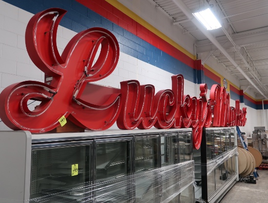 Lucky's Market neon sign