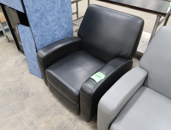 black cushioned recliner chair