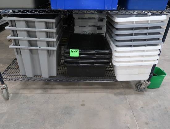 bottom shelf of plastic tubs