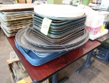 stack of trays, lids, cutting boards