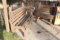 Two Wooden Benches And Table Under Cabana