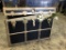 Storage Chest And Faux Plants