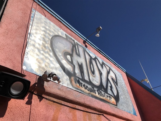 Metal Chuy's Sign On Patio Wall