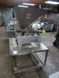 Hinds Bock 4-piston depositer, mounted on table, w/ casters
