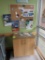 wooden cabinet w/ granite top & bulletin board