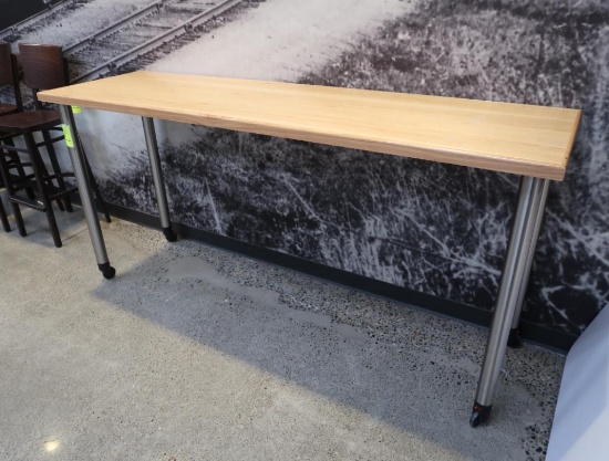 wooden table w/ steel legs, on casters