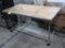 table on casters, steel frame w/ wooden top