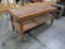wooden table w/ slatted top, on casters