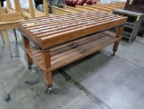 wooden table w/ slatted top, on casters