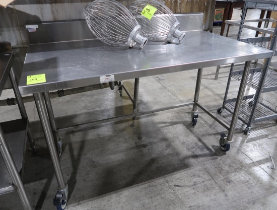 stainless table w/ backsplash, on casters