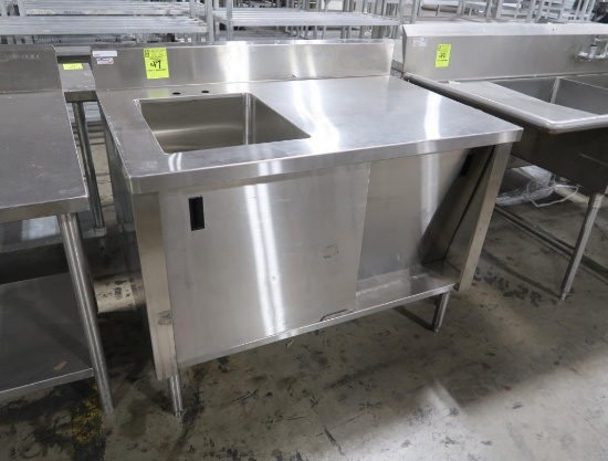 stainless table w/ single comp sink, backsplash, & cabinets under