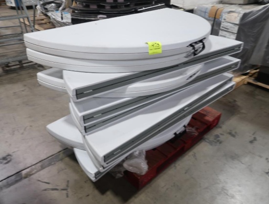 pallet of round folding tables w/ plastic tops