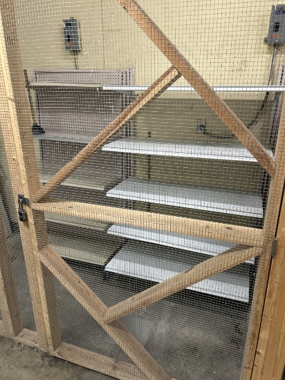 WALL SHELVING INSIDE OF CAGED AREA