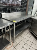 72IN X 25IN X 41IN STAINLESS STEEL TABLE W/ BACKSPLASH