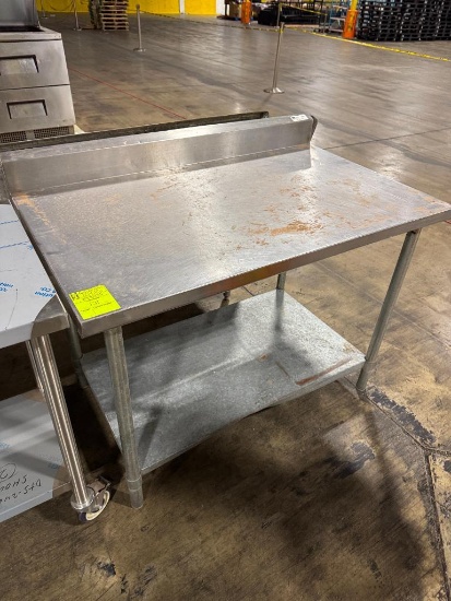Stainless steel table w/ backsplash & undershelf