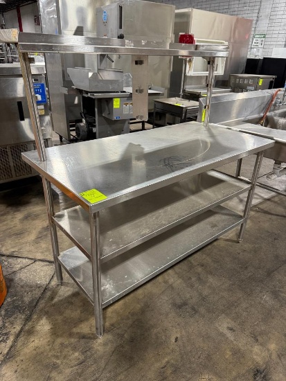 Stainless steel table w/ two undershelves and one upper
