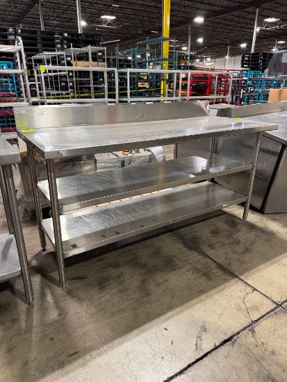 Stainless steel table w/ two undershelves and backsplash