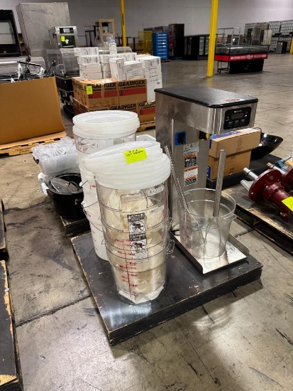 Pallet of food containers and Bunn coffee maker