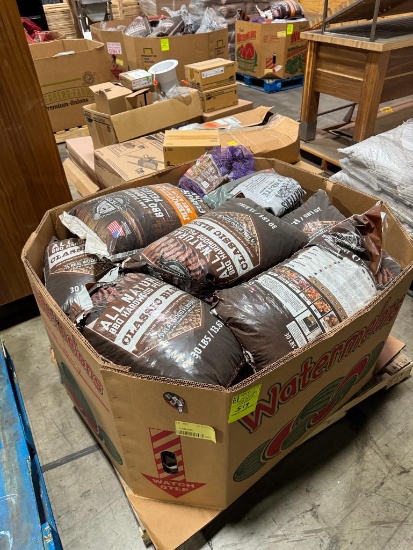 Pallet of smoking pellets and wood
