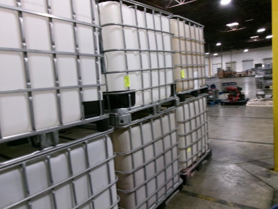 Large plastic liquid containers with dispenser valve in metal frame