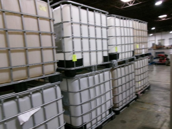 Large plastic liquid containers with dispenser valve in metal frame