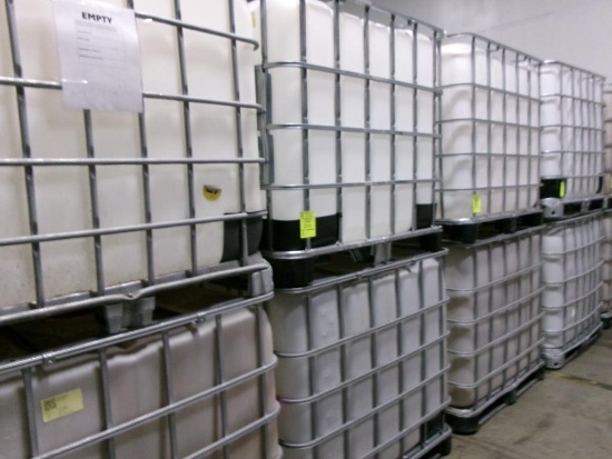 Large plastic liquid containers with dispenser valve in metal frame