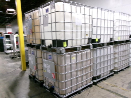 Large plastic liquid containers with dispenser valve in metal frame