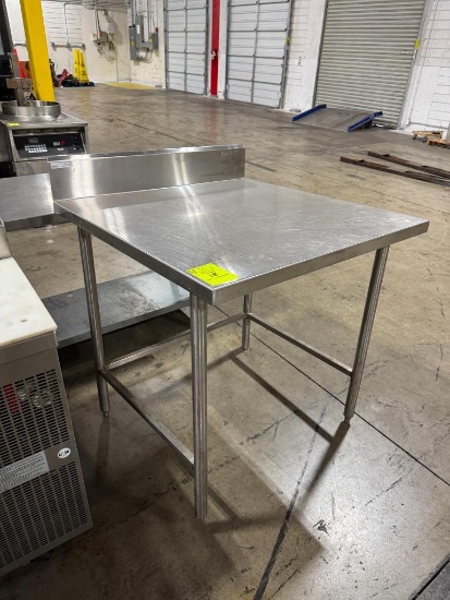 Stainless steel table, missing two adjustable feet