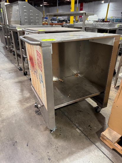 Stainless steel table with adjustable bottom shelf on casters