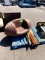 FOOTBALL CHAIR AND ASSORTED POOL CUES